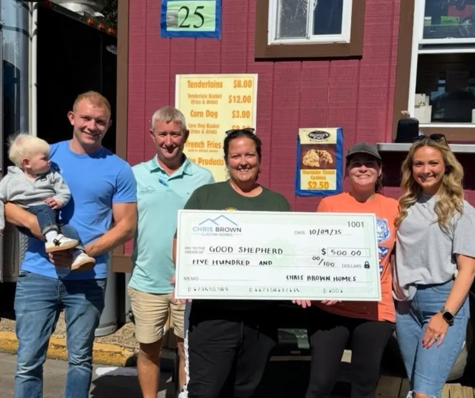 Five adults and a toddler present Good Shepherd with $500, giving back to the community.